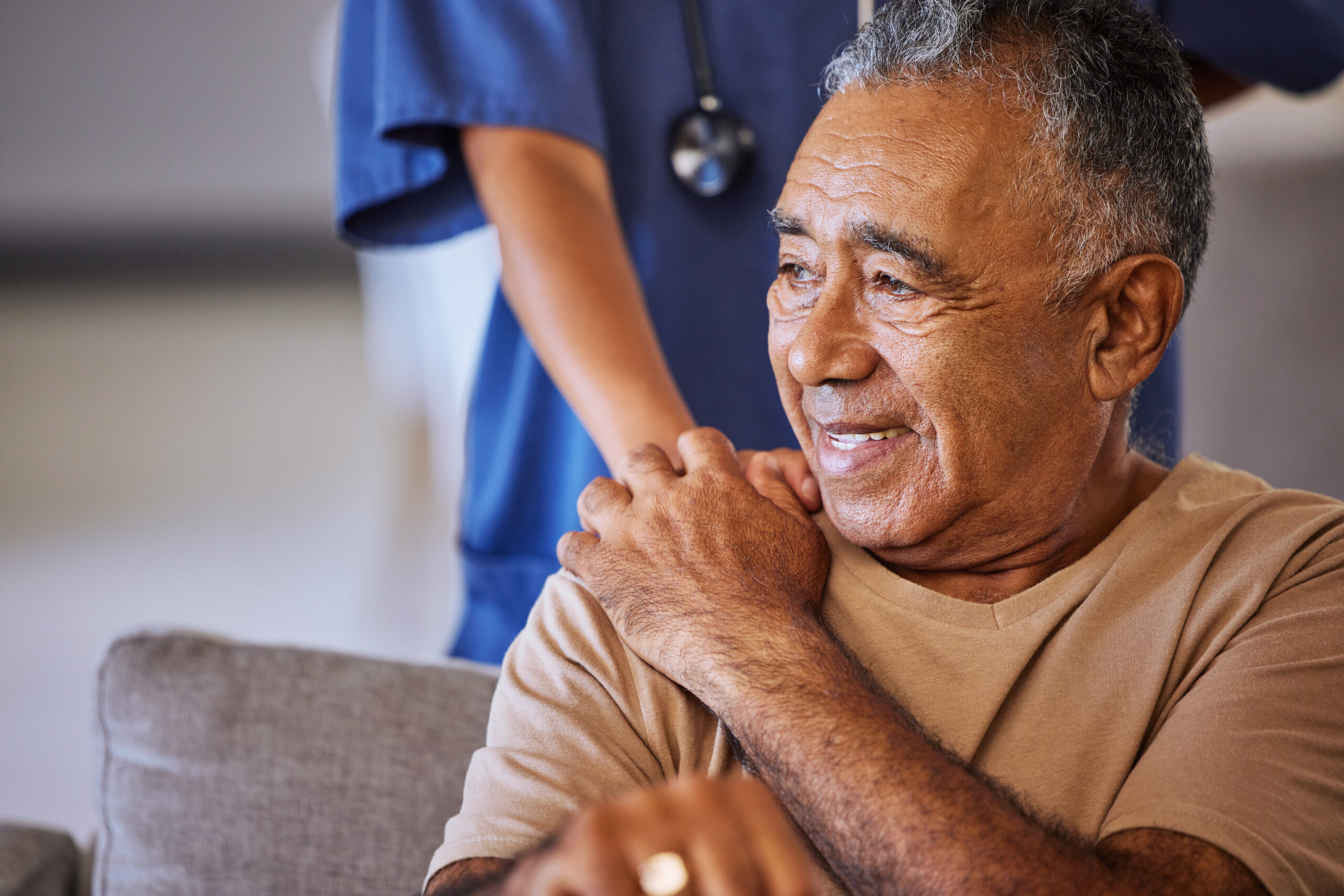 Caregiver holding hand of senior patient