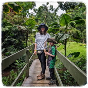 Natalia stands beside her son in a photo that is used to tell her Patient Testimony story