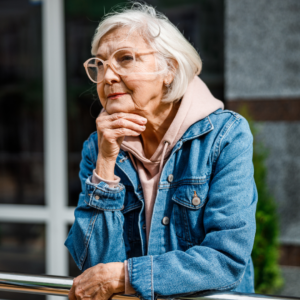 Elderly woman staring ahead to support an article about gene and cell therapy