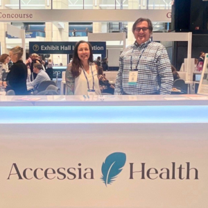 Jennifer Noonan and Alan Wood attend a conference