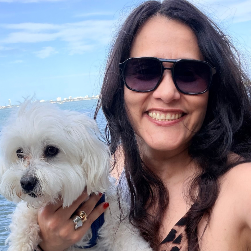 Narah Cano smiles as she holds her dog | Fabry Disease